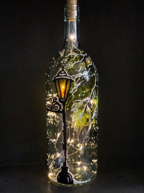 When Lucy stepped out of the Wardrobe, the first landmark she finds is this lantern, alone in a snowy wood. Painted on a recycled bottle with acrylic paint. The bottle is lit with fairy lights from within.