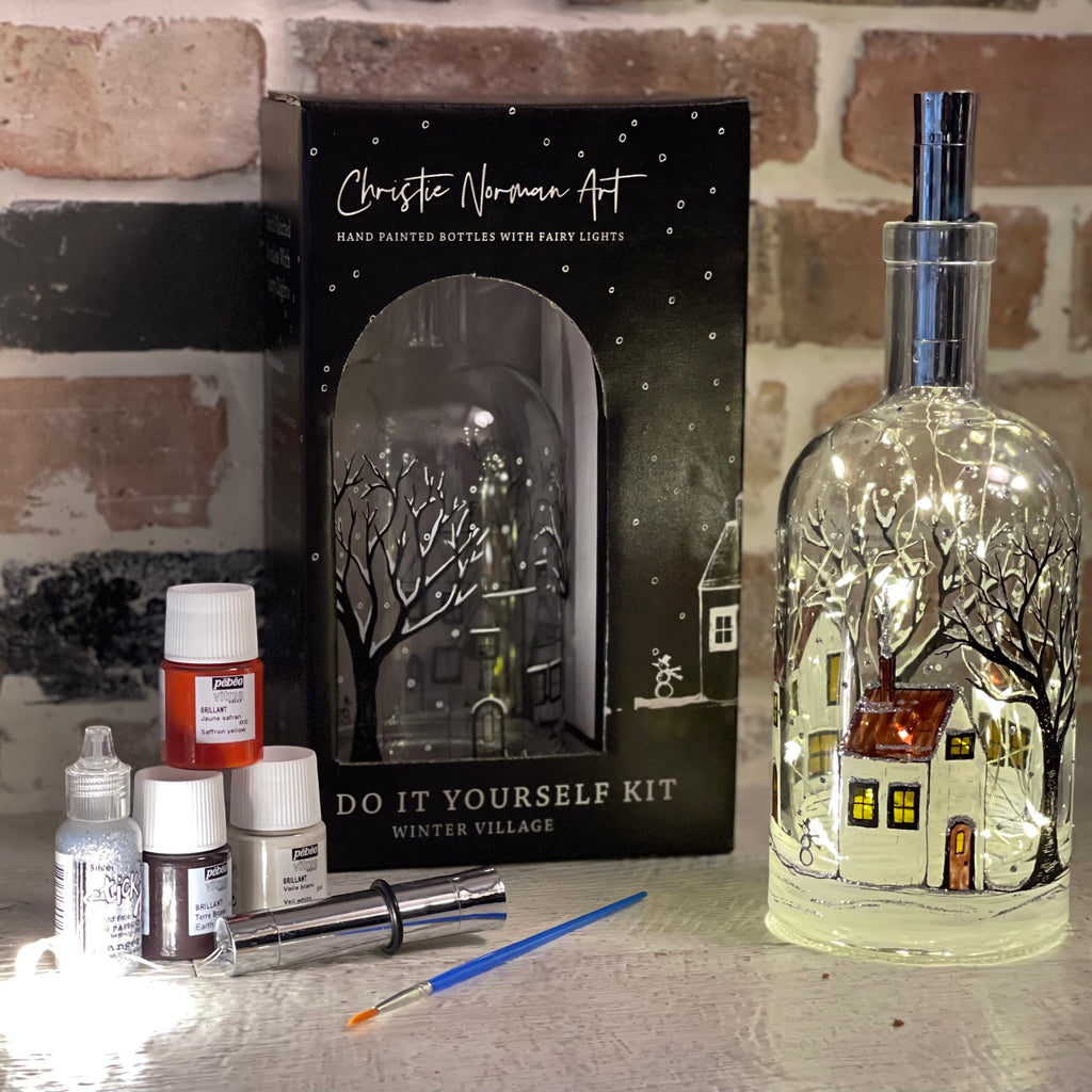 This Winter Village DIY Kit provides everything needed to paint your own bottle.